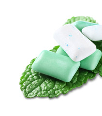 Chewing gums and mint on white background