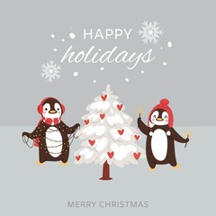 Merry Christmas cute penguins greeting card vector illustration. Two cartoon penguins decorating winter snowy xmas tree and Merry Christmas and happy holidays lettering.