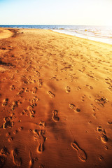 Sandy seaside with footprints