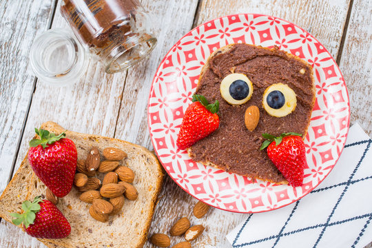 Fun food for kids. Sweet cream of almond, cocoa and date palm. Sandwich in the form of an owl