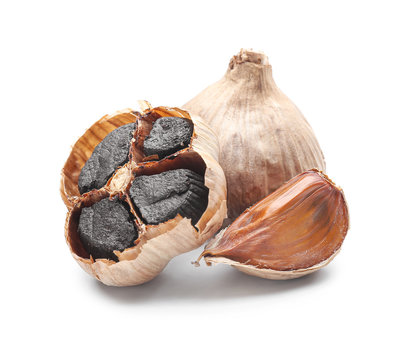 Black garlic on white background