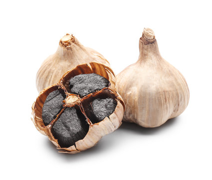 Black garlic on white background