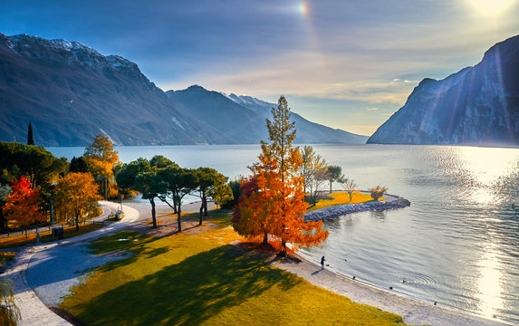 Beautiful and colorful autumn in Riva del Garda, Garda lake surrounded by mountains, Trentino Alto Adige region, Lago di garda, italy