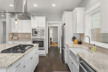 Beautiful kitchen in new home, with stainless steel appliances