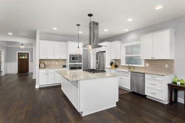 Beautiful kitchen in new home, with stainless steel appliances