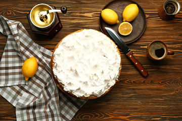 Tasty lemon pie on wooden table