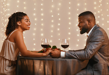 Romantic couple in love having date at restaurant