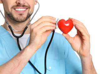 Male cardiologist with red heart on white background