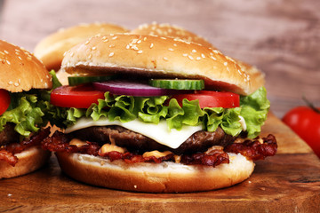 Tasty fresh meat burgers with salad and cheese. Homemade angus burger.