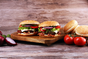 Tasty fresh meat burgers with salad and cheese. Homemade angus burger.