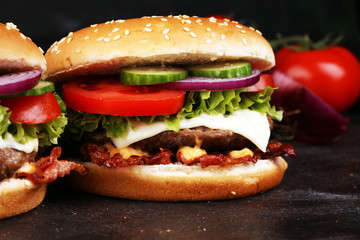 Tasty fresh meat burgers with salad and cheese. Homemade angus burger.
