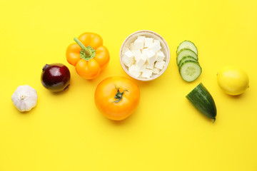 Ingredients for tasty Greek salad on color background
