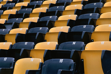 Empty row of seats in sports stadium