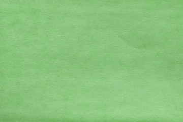 Fototapeta premium Cardboard green abstract pattern texture close-up. Retro old paper background. Grunge concrete wall. Vintage blank wallpaper.