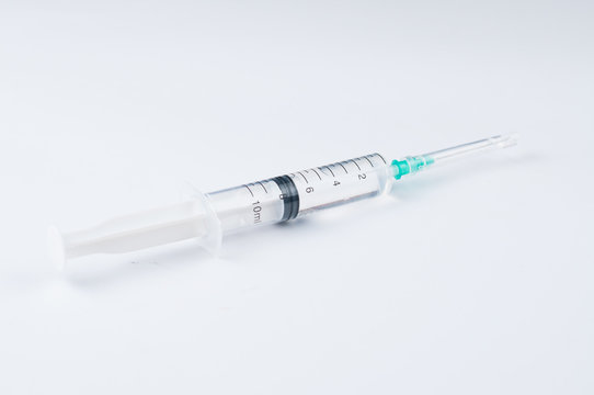 Syringe and needle isolated on white background.Copy space
