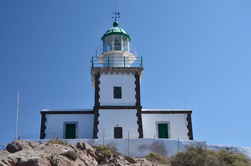 Fototapeta na wymiar Akrotiri Lighthouse on Santorini Greece, sunny day, blue sky