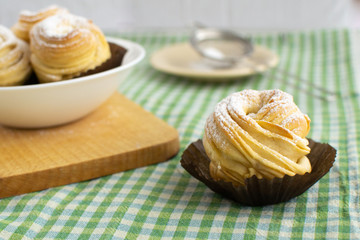 Cruffins without filling on a green background. Rustic style.