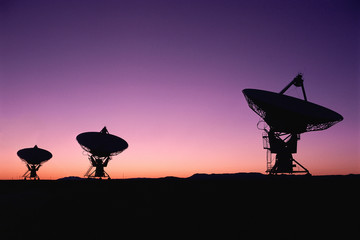 VLA Very Large Array radio telescope dish field in twilight