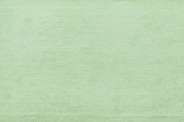 Fototapeta premium Cardboard green abstract pattern texture close-up. Retro old paper background. Grunge concrete wall. Vintage blank wallpaper.