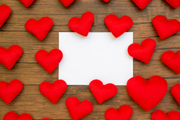 Obraz premium hearts composition. Frame made of red hearts, on wood background. Valentines day background. Flat lay, top view, copy space.