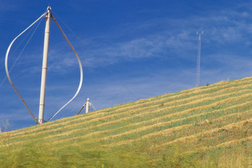 Fototapeta na wymiar Vertical-axis wind turbine on slope