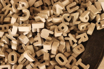stone letters and numbers in a pile
