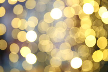 background with blurred circles of lights. defocused lights of festive garland 