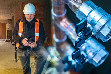 The plumber orders the necessary materials via the Internet. Pipes in the new building. Providing...