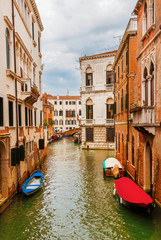 View of a characteristic Venice canal and old traditional houses in the quiet Santa Croce District