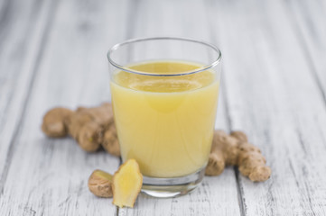 Portion of Ginger Juice as detailed close-up shot; selective focus