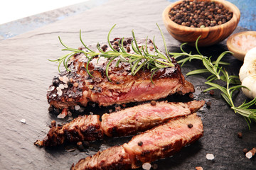 Barbecue Rib Eye Steak on Slate Slab - Dry Aged Wagyu Entrecote Steak and rosemary