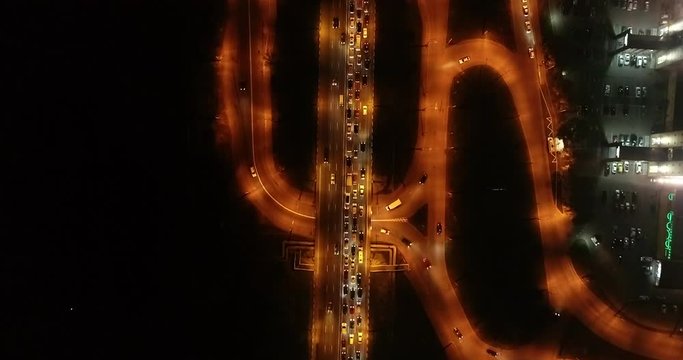 4K Aerial Top Drone View: Accident and traffic jam on the bridge in the evening after a working day. A huge number of cars on the road at rush hour. Downtown, city central part. Camera looks down.