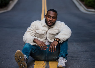 Man sitting in urban street
