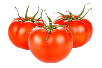 Three ripe bright red tomatoes with green leaves isolated on a white background