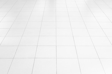 White tile floor background in perspective view. Clean, shiny, symmetry with grid line texture. For...