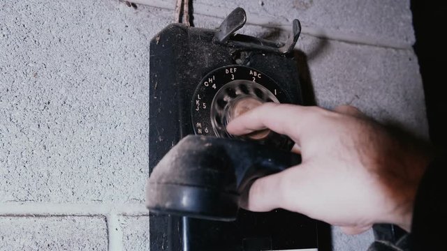 dialing 555 number on an old dial phone