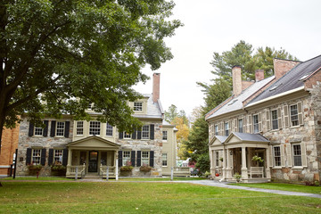 Obraz premium Residential neighborhood with historic homes on a Fall day in the New England town of Woodstock, Vermont