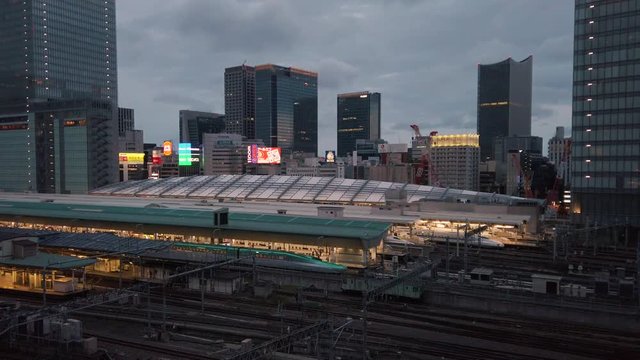 Video of high speed Japanese Shinkansen E7 and N777 trains docked in Tokyo railway station in the Chiyoda City, Tokyo, Japan.