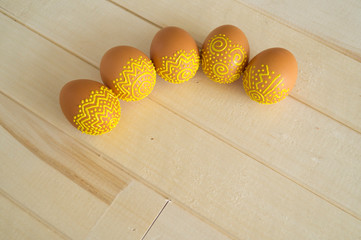 Easter eggs pattern. Volumetric yellow paint.