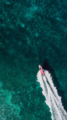 Aerial photography of a boat in the caribbean sea
