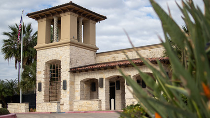 Classic building with trees and a beautiful blue  sky