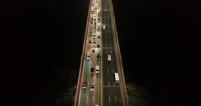4K Aerial Top Drone View: Accident and traffic jam on the bridge in the evening after a working day. A huge number of cars on the road at rush hour. Downtown, city central part.