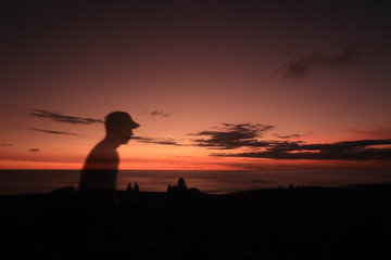 silhouette of man at sunset with blank space for text