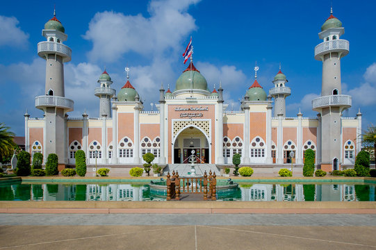 Beautiful central mosque and reflection in water at Pattani Central Mosque Thailand.(Translate Thai and Arab text in the picture is the name of The central mosque of Pattani Province)
