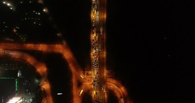 4K Aerial Top Drone View: Accident and traffic jam on the bridge in the evening after a working day. A huge number of cars on the road at rush hour. Downtown, city central part. Dnipro, Ukraine