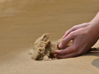 Play with sand at beach
