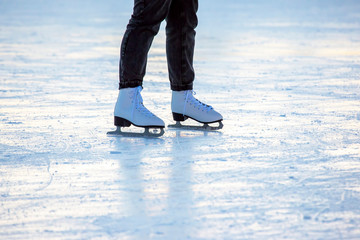 Fototapeta na wymiar girl ice skating on an ice rink. hobbies and leisure. winter sports