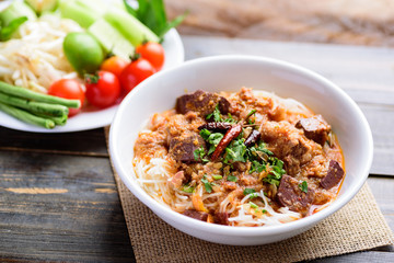 Northern Thai food (Kanom Jeen Nam Ngeaw), rice noodles with spicy soup in a bowl 