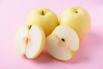 Fresh Asian pear fruit on pink background