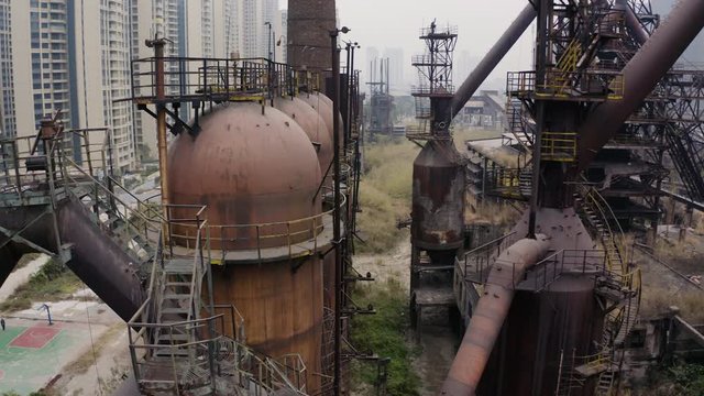Slow pivot around metal structures and machinery of an abandoned steel mill, Guangzhou, China